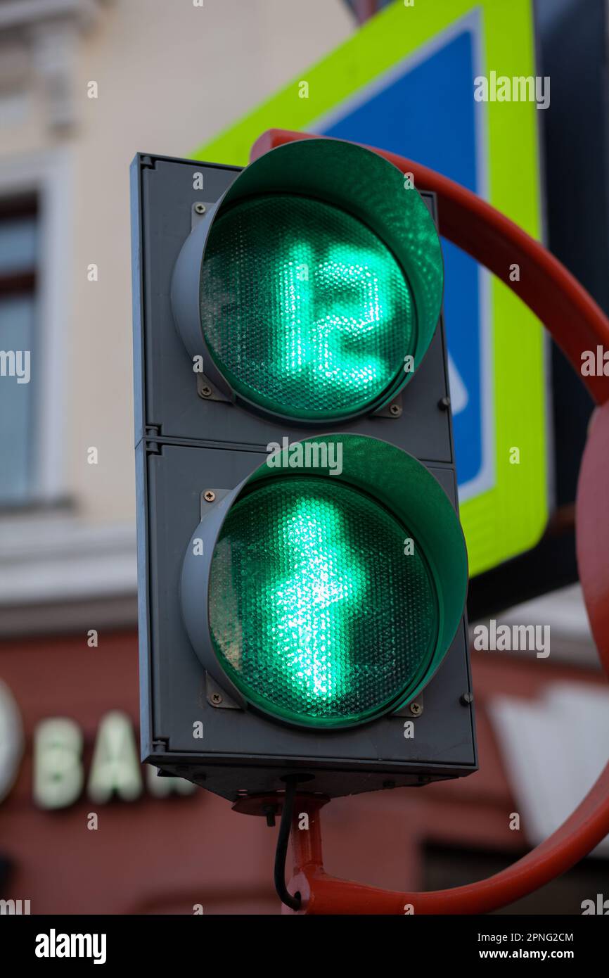 Green light on a pedestrian traffic light. Safe crossing of the road by pedestrians Stock Photo