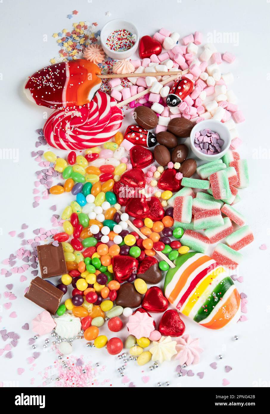 Assortment of colorful candy on a white background. Top view. Stock Photo