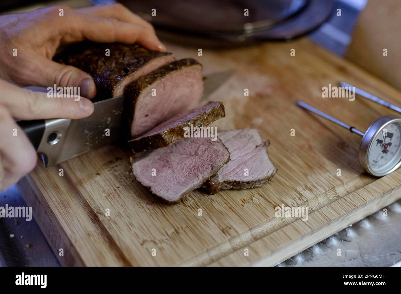 Beef roast is cut into pieces Stock Photo Alamy