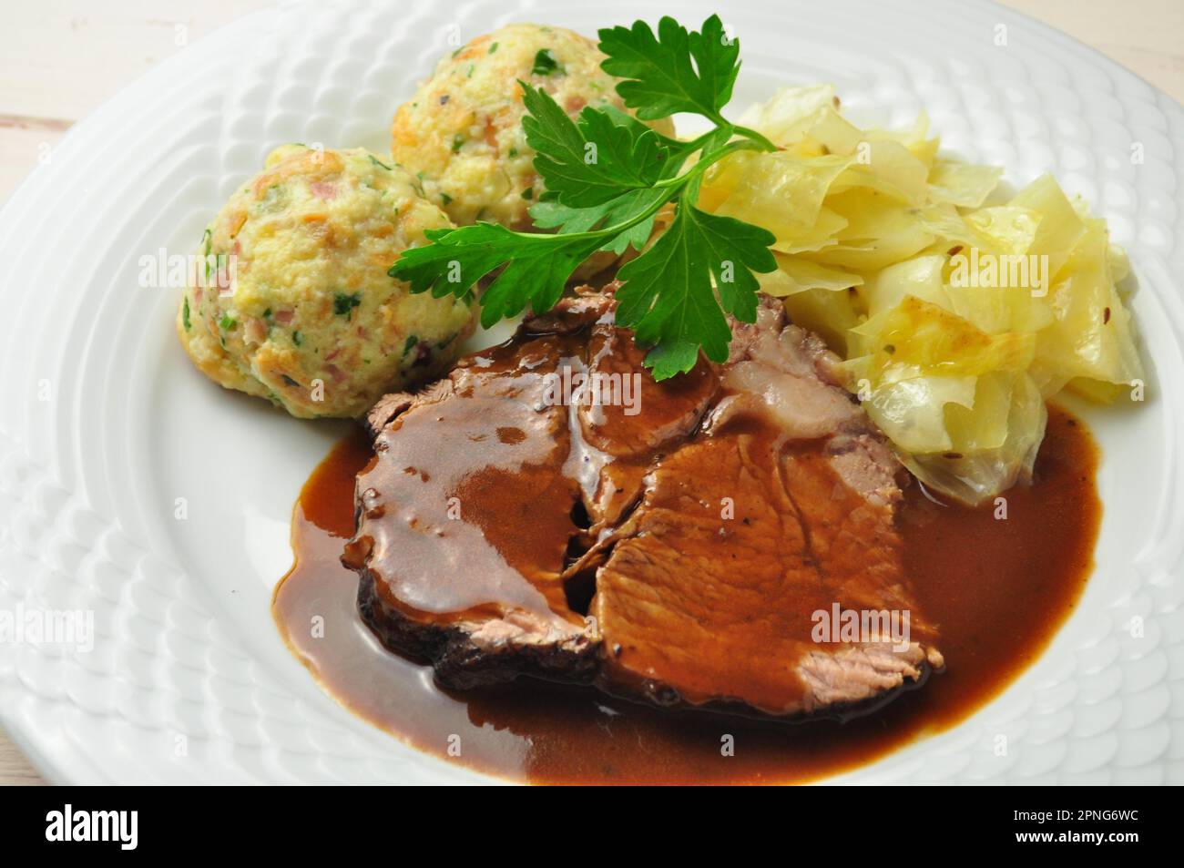 Roast beef with bread dumplings and white cabbage Stock Photo Alamy