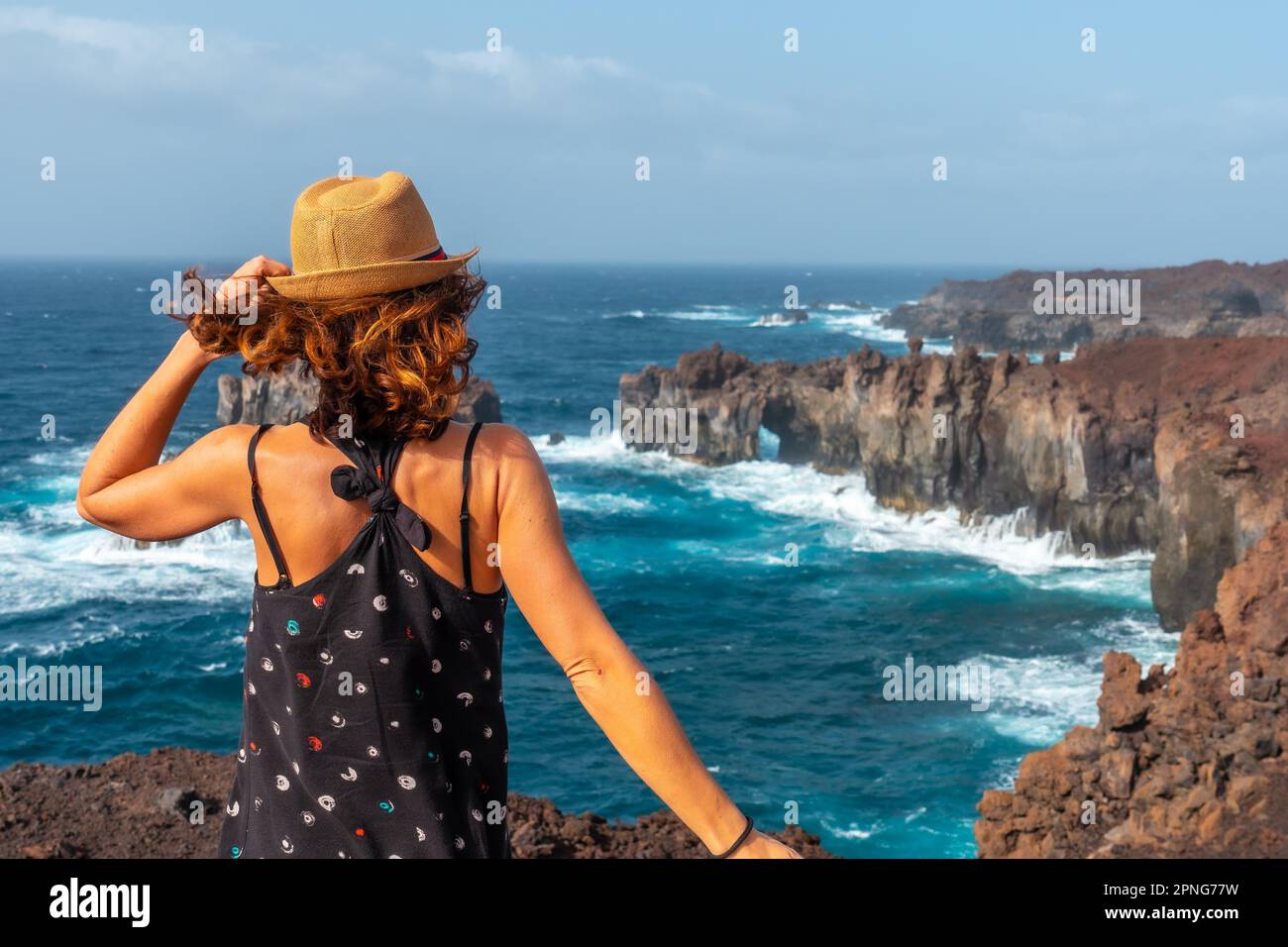 El Hierro Island. Canary Islands, a young tourist visiting the Arco de la Tosca. monument on the coast Stock Photo