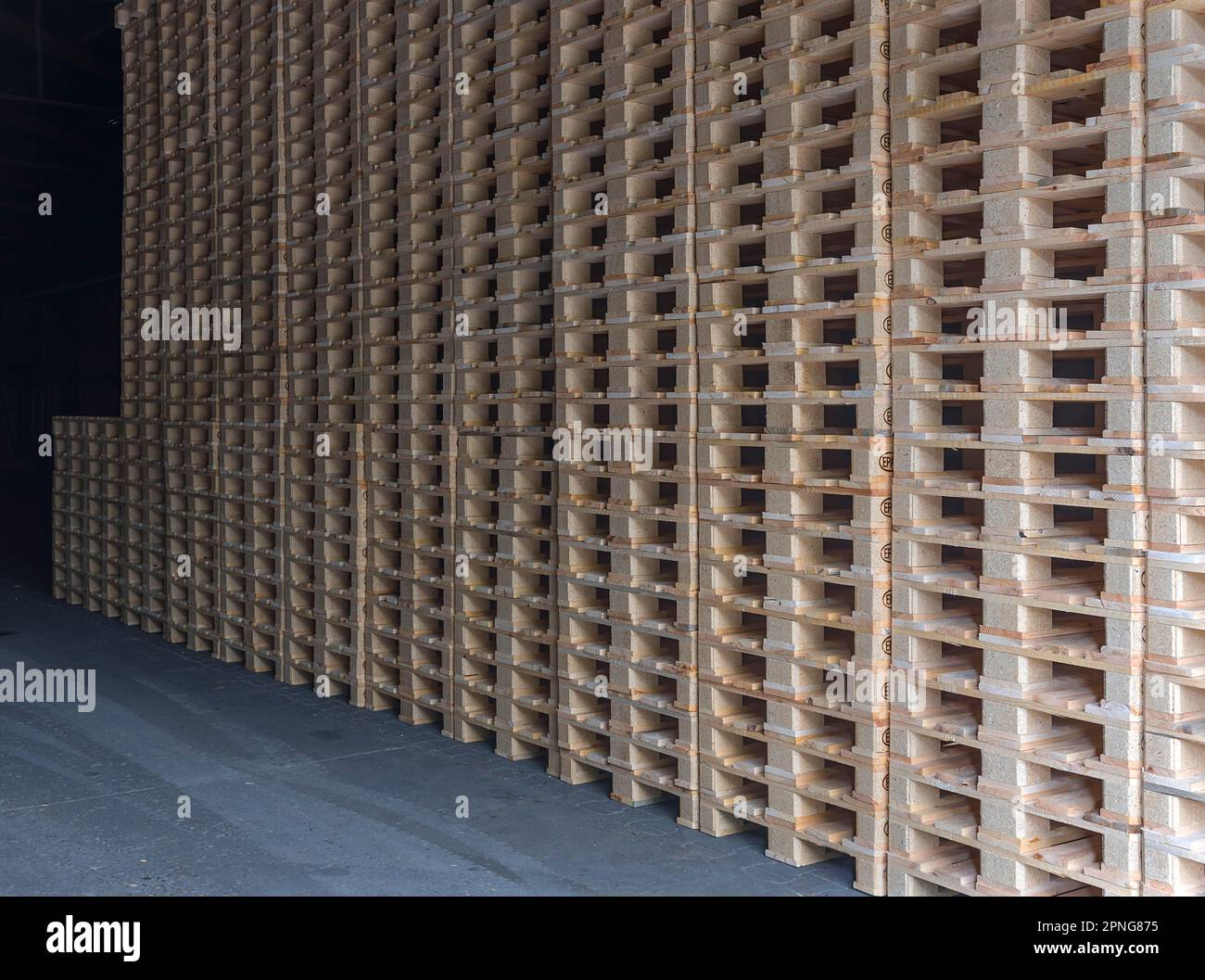 Stacked euro pallets in a former paper factory, Lost Place, Baden-Wuerttemberg, Germany Stock Photo