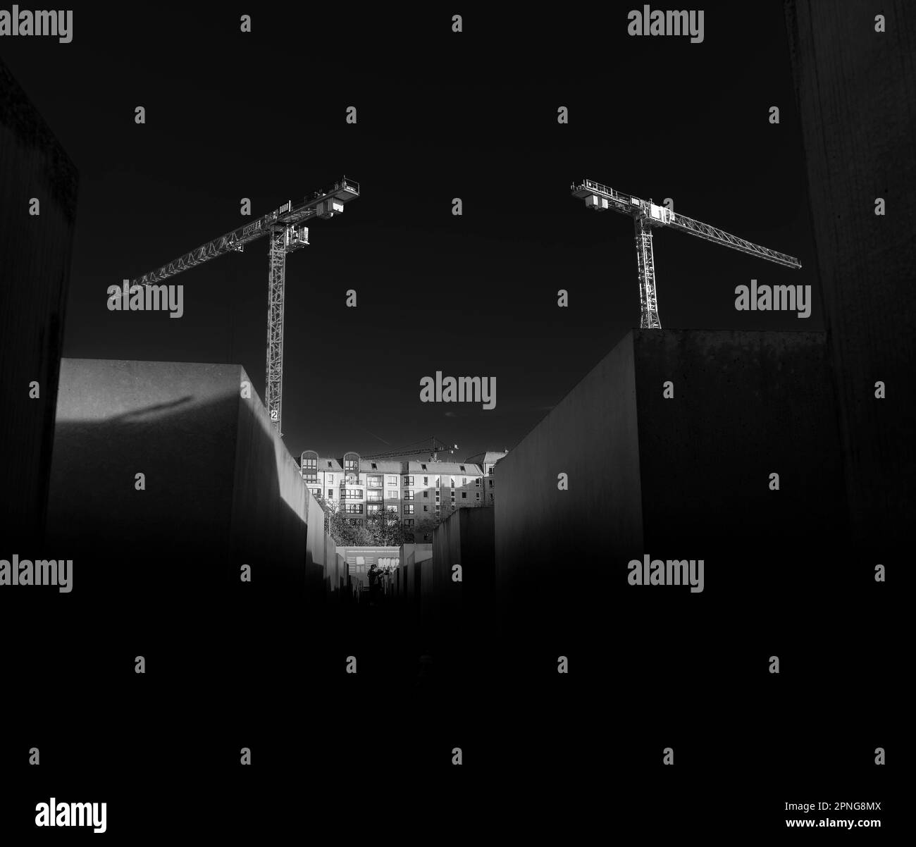 Two construction cranes Black and White Stock Photos & Images - Alamy