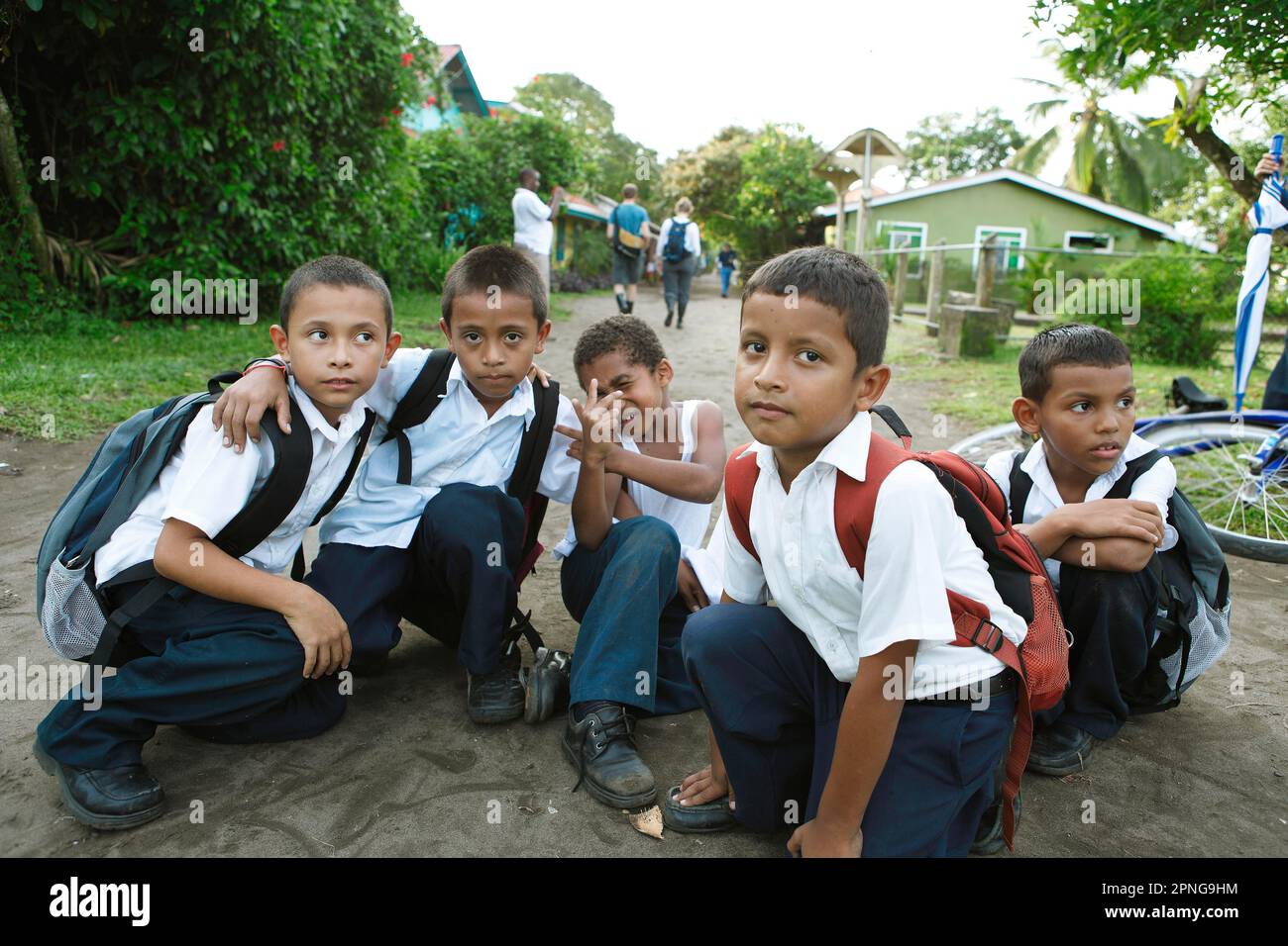 Schoolchildren in uniforms on the main street of Tortuguero, Tortuguero