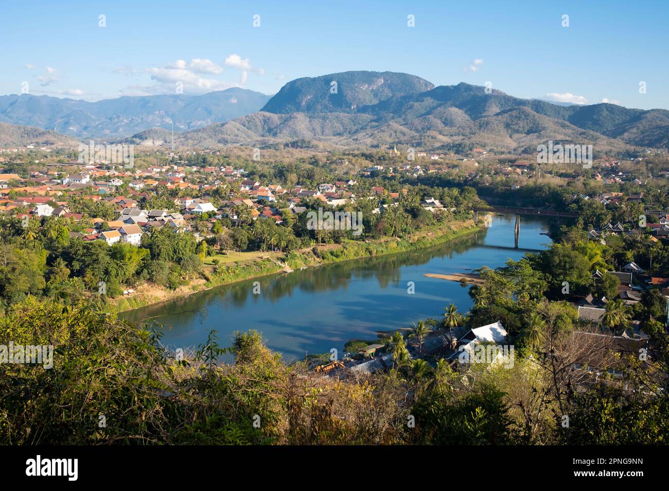 Laos: Luang Prabang and the Nam Khan River seen from Mount Phousi situated in the middle of the town. Luang Prabang was formerly the capital of a kingdom of the same name. Until the communist takeover in 1975, it was the royal capital and seat of government of the Kingdom of Laos. The city is nowadays a UNESCO World Heritage Site. Stock Photo