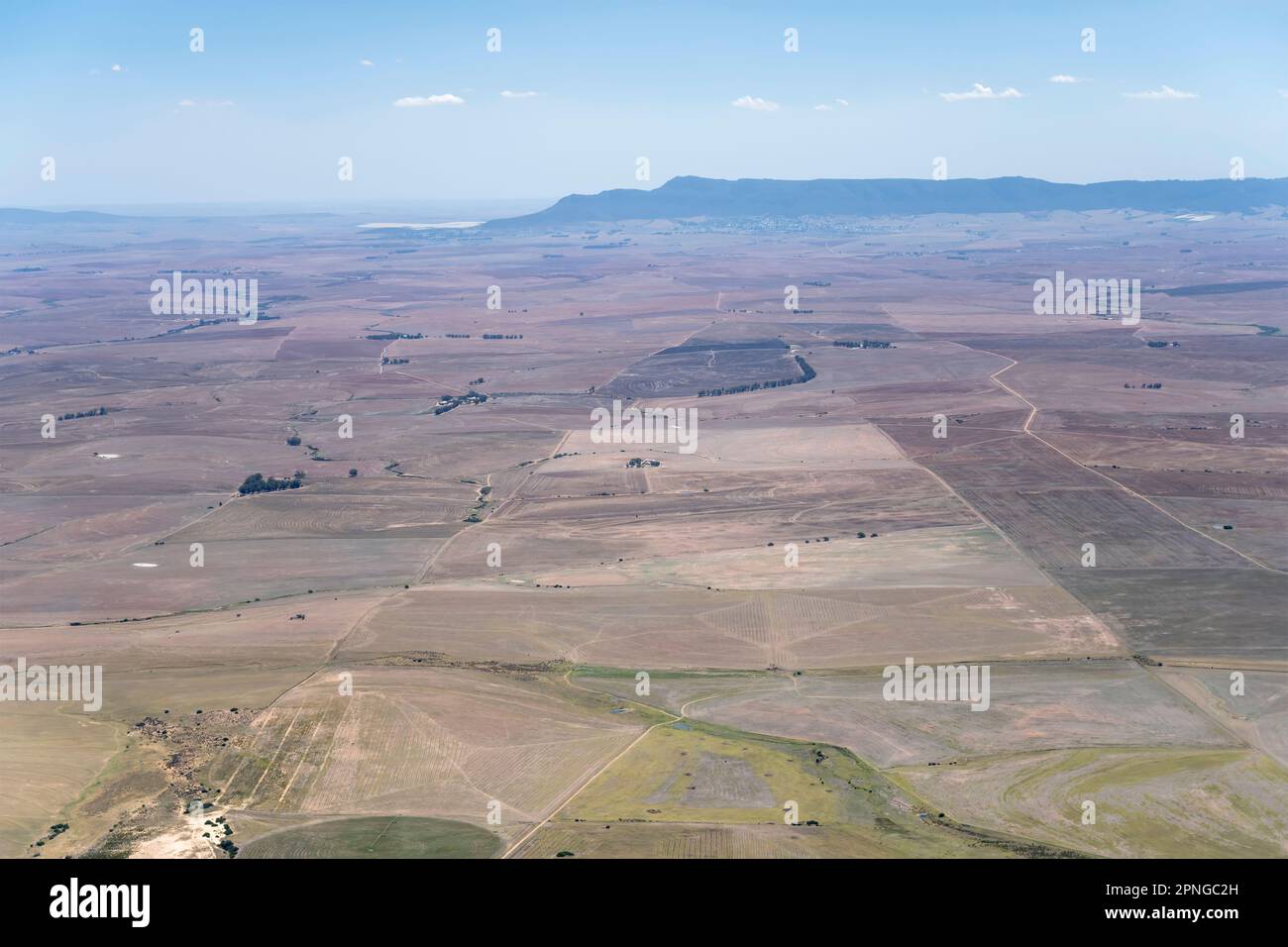 aerial landscape, from a glider, with farms and cultivated fields in