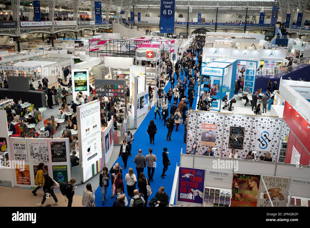 Aerial view of the London Book Fair at Hammersmith's Olympia Exhibition Hall, on 18th April 2023, in London, England. The three-day international London Book Fair (LBF) is an annual publishing industry expo and Europe's largest spring book fair that typically attracts 25,000 visitors; exhibitors from across the publishing sector; authors hoping for their book ideas to be commissioned and where international publication rights deals are made for foreign editions. Stock Photo
