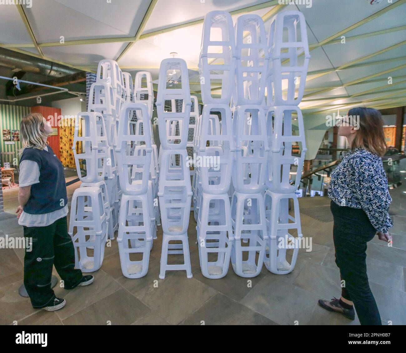 London, UK. 19th Apr, 2023. a striking urban landscape installation constructed from Vietnamese plastic stools, highlighting the psychogeography of migrant populations. Through our collections, exhibitions, events, performances, and debates, we reveal diverse, thought-provoking and personal stories of the home from the last 400 years to the present and looking into the homes of the future. Credit: Paul Quezada-Neiman/Alamy Live News Stock Photo