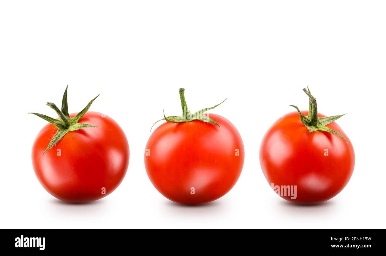 Small red cherry tomatoes on white background. Stock Photo