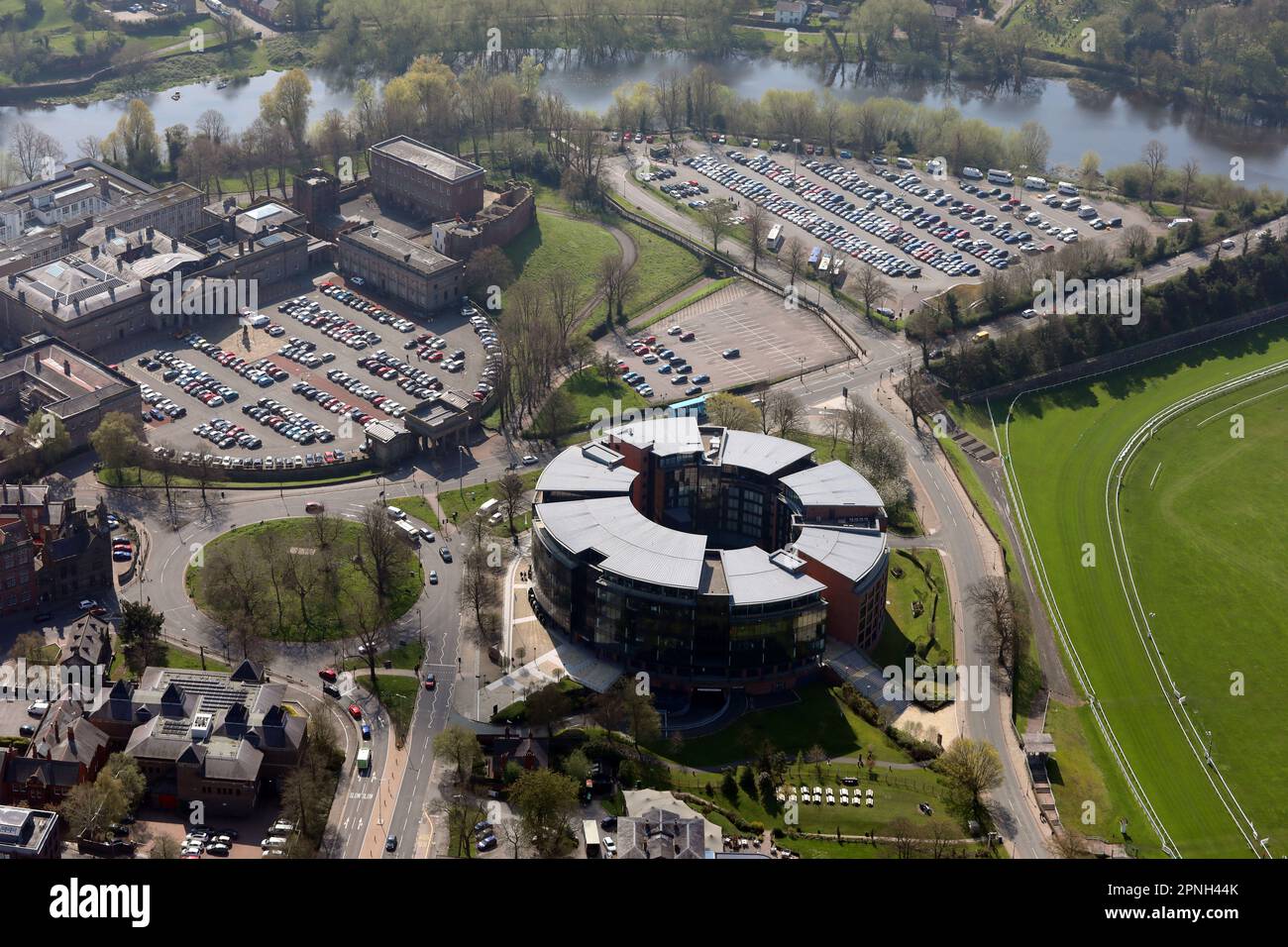 aerial view of a cricular retail, hotel and office building in Chester, Cheshire, UK (the Castle, Crown Court & River Dee are in the backgound) Stock Photo