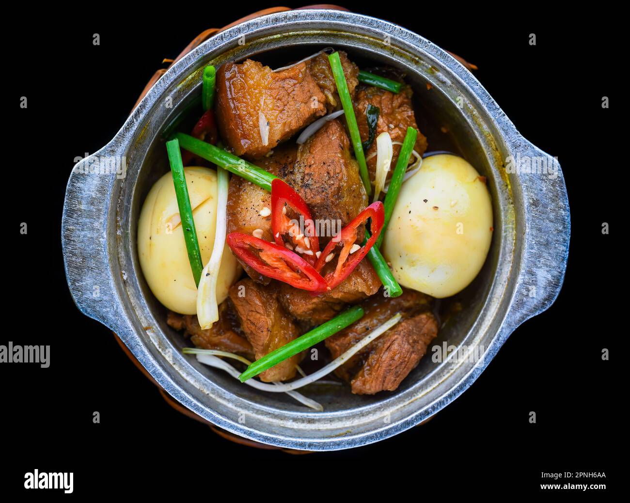 Vietnamese braised pork with boiled eggs in soy sauce for a menu Stock