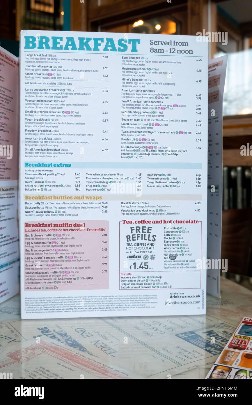 A menu card from a JD Wetherspoons pub. The card shows the prices of the popular breakfast options available in the pub every morning Stock Photo