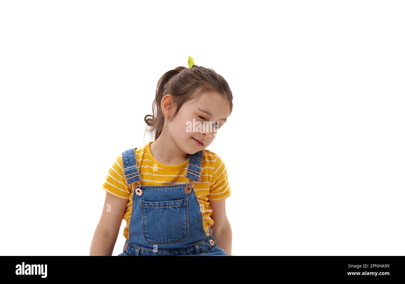 Close-up portrait of Caucasian lovely baby girl winking looking at ...