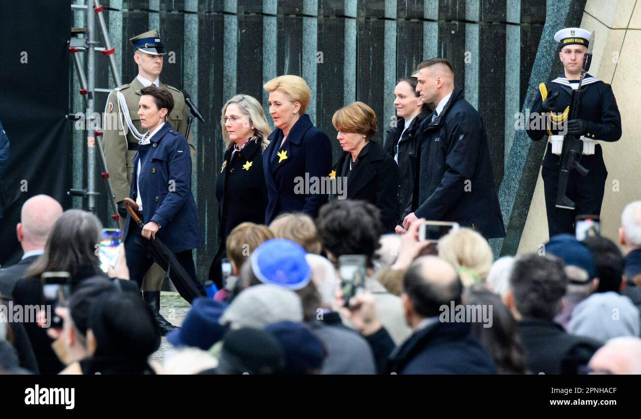 Warschau, Poland. 19th Apr, 2023. The wives of the presidents of Germany, Elke Büdenbender (r-l), Poland, Agata Kornhauser-Duda, and Israel, Michal Herzog, arrive at the commemoration of the 80th anniversary of the Warsaw Ghetto Uprising at the square in front of the Monument to the Heroes of the Ghetto. On April 19, 1943, Jewish insurgents in Warsaw rose up against SS units marching into the ghetto. Only a few Warsaw Jews survived the suppression of the uprising. Credit: Bernd von Jutrczenka/dpa/Alamy Live News Stock Photo