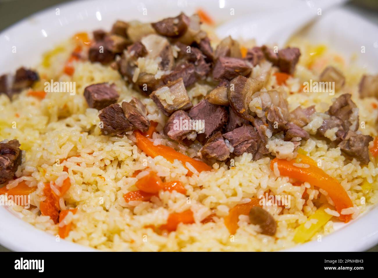 A delicious Chinese Xinjiang dish, mutton hand pilaf Stock Photo Alamy