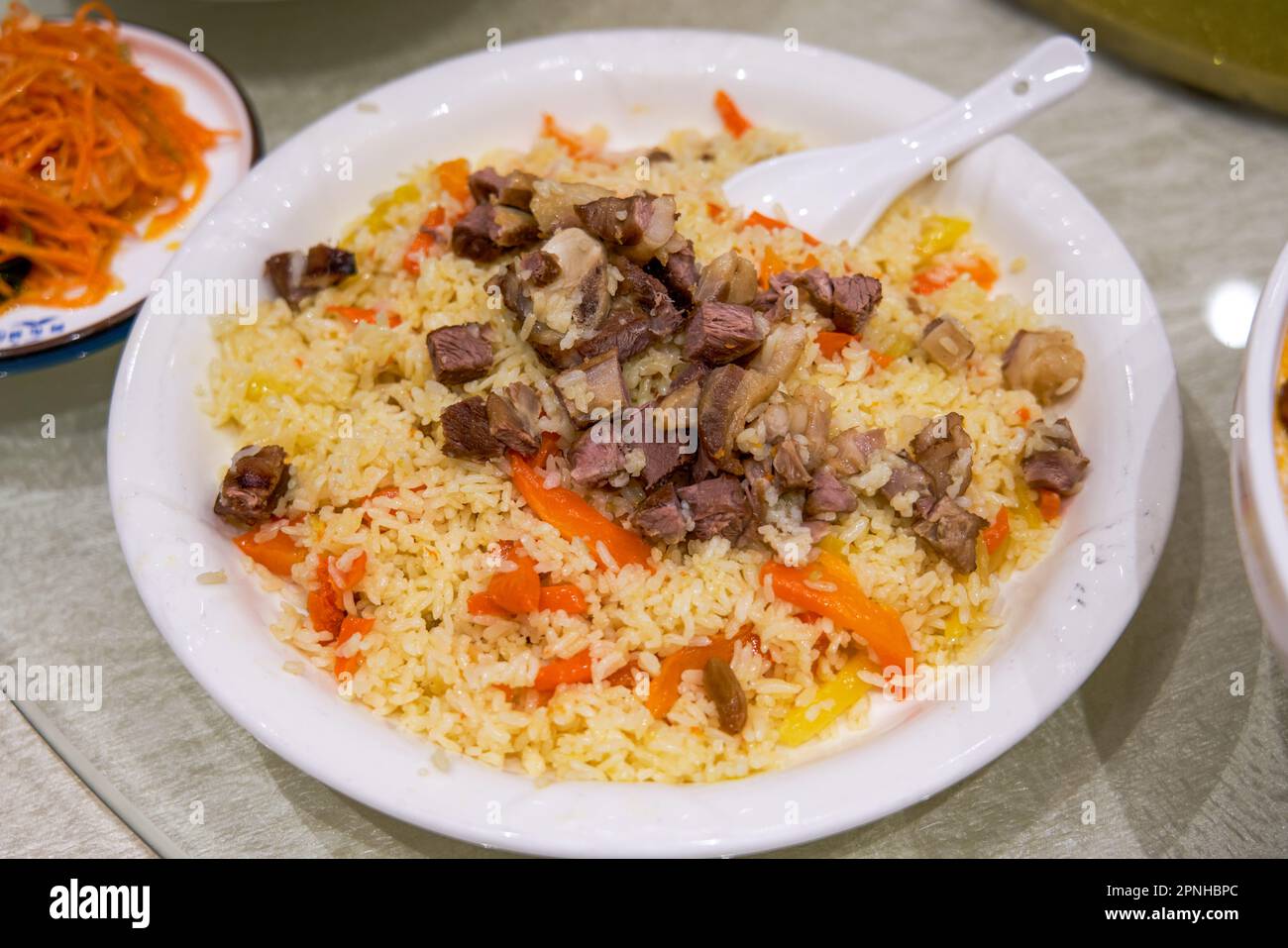 A delicious Chinese Xinjiang dish, mutton hand pilaf Stock Photo Alamy