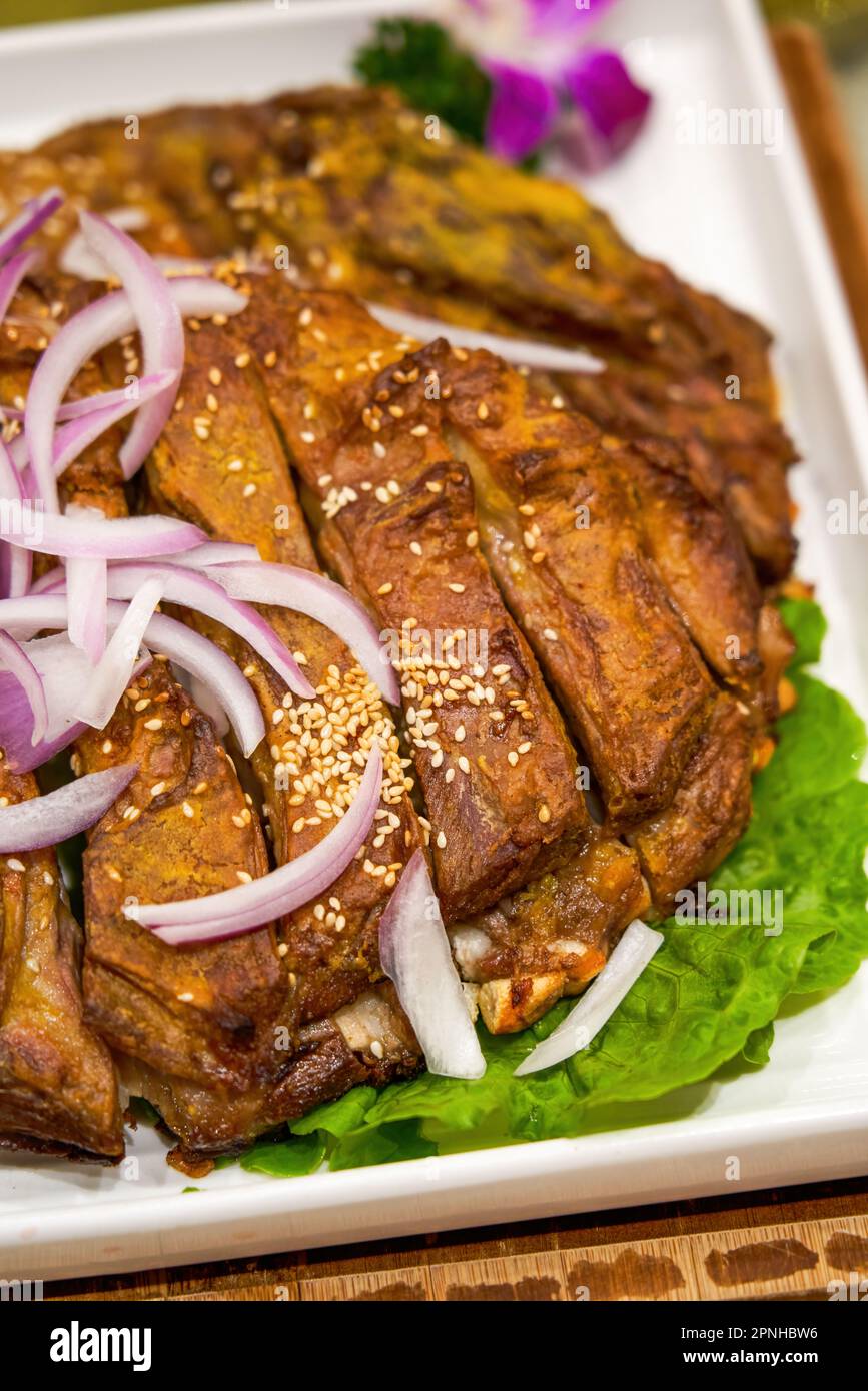 A delicious Chinese Xinjiang dish, grilled lamb chops Stock Photo Alamy