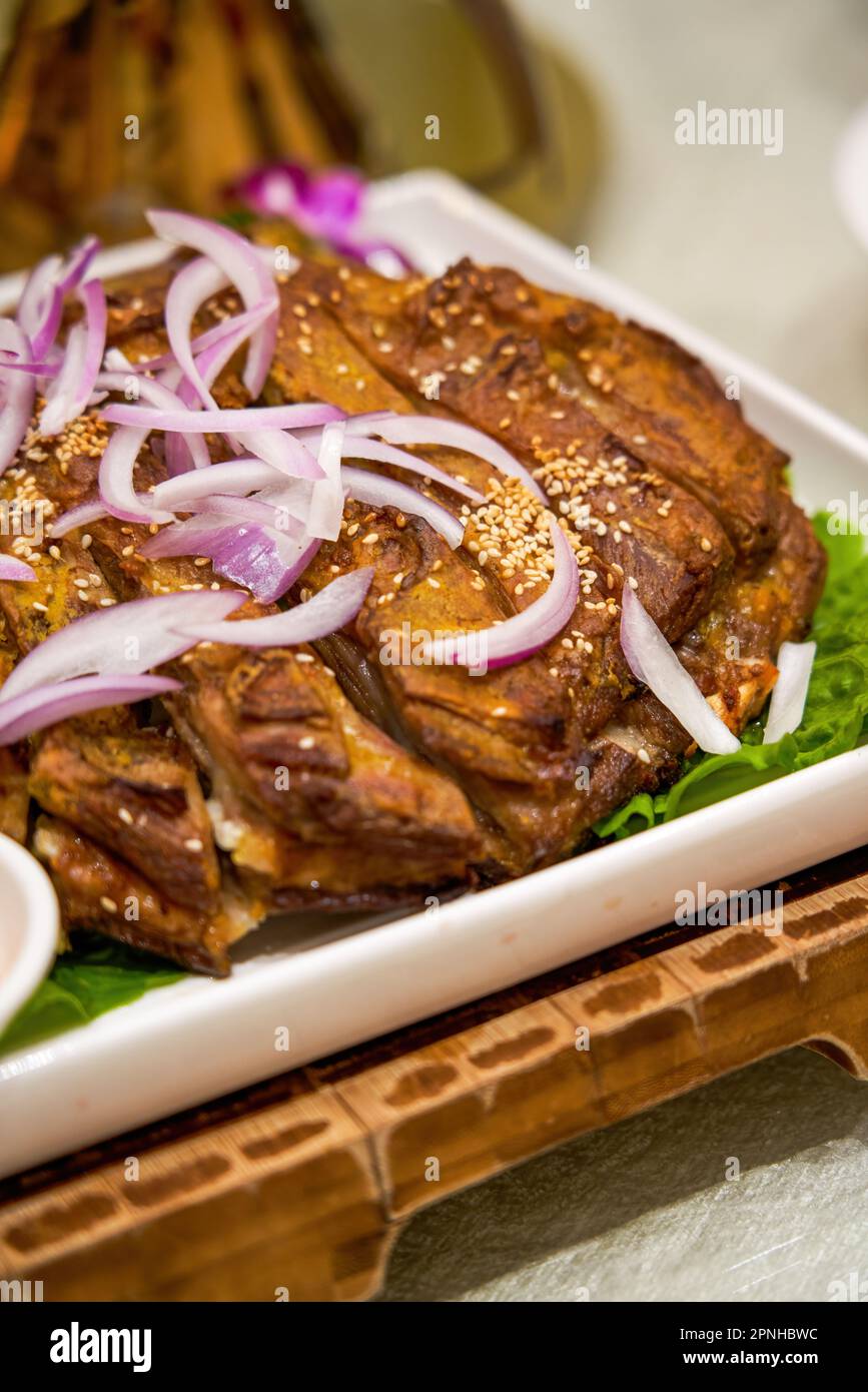 A delicious Chinese Xinjiang dish, grilled lamb chops Stock Photo Alamy
