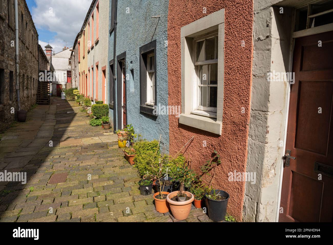 A lane of colourful terraced houses in the town of Cockermouth