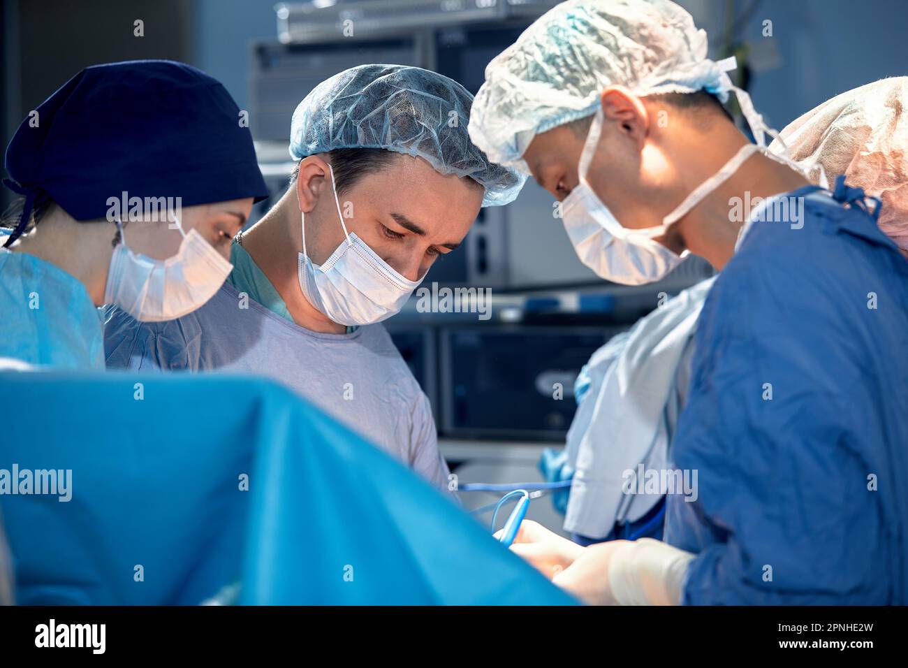 faces of surgeons in the operating room during the operation. Modern ...