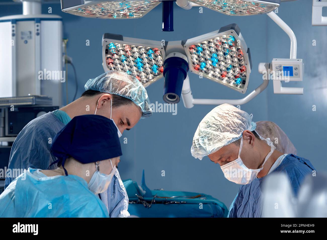 faces of surgeons in the operating room during the operation. Modern ...