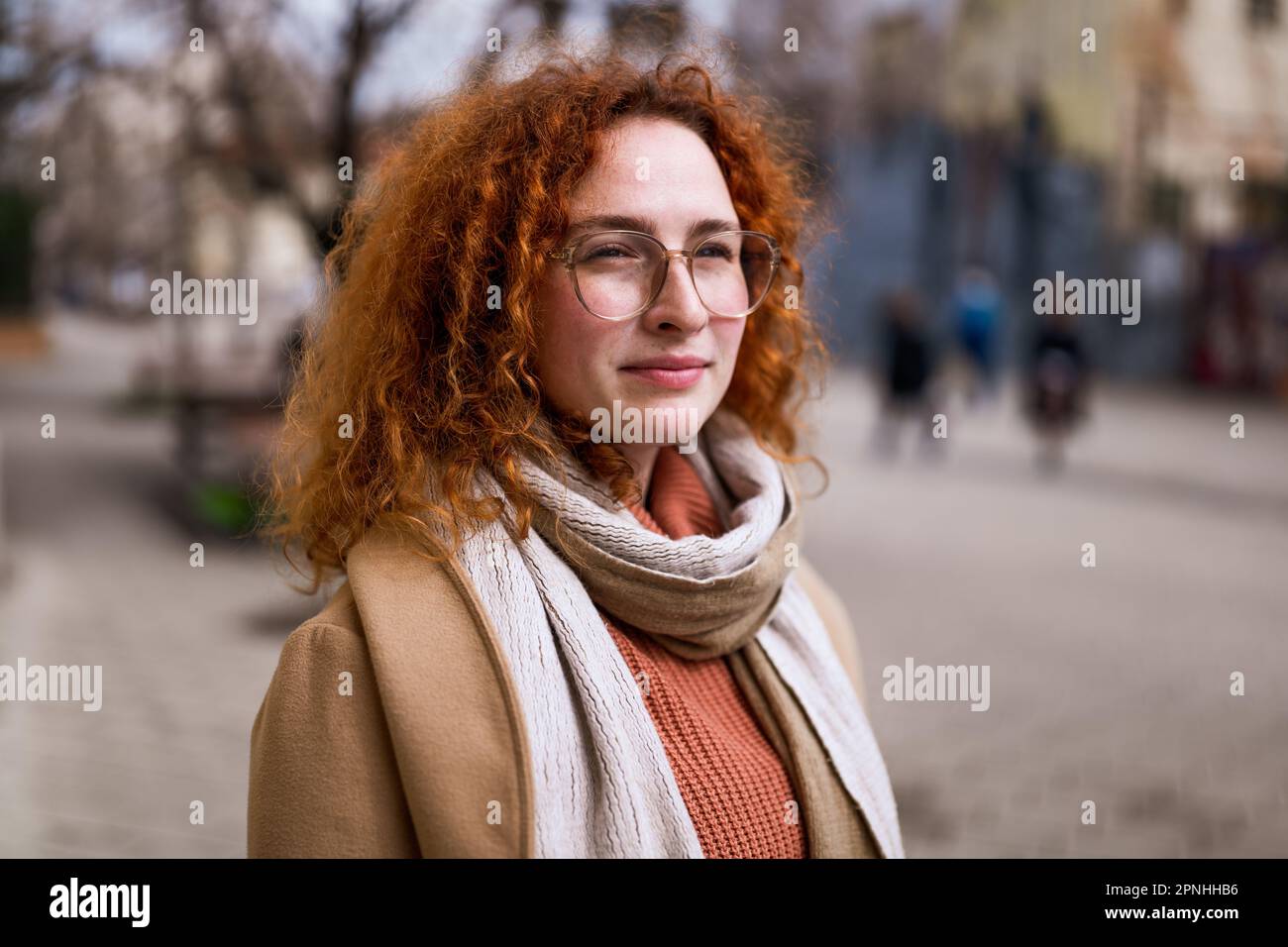 Natural portrait of pensive caucasian ginger woman with freckles and