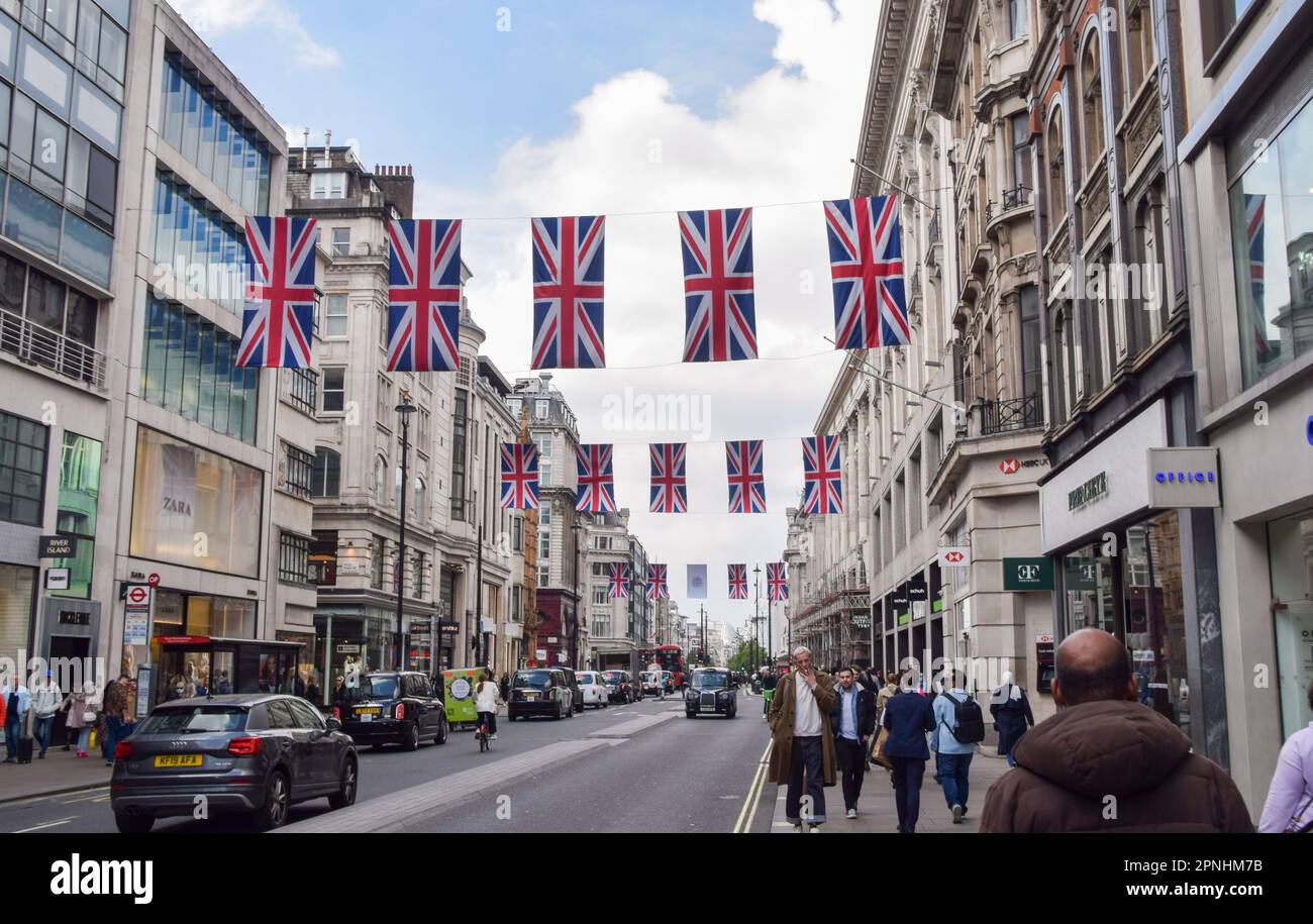 London, UK. 19th April 2023. Union Jacks have been installed in Oxford Street as preparations