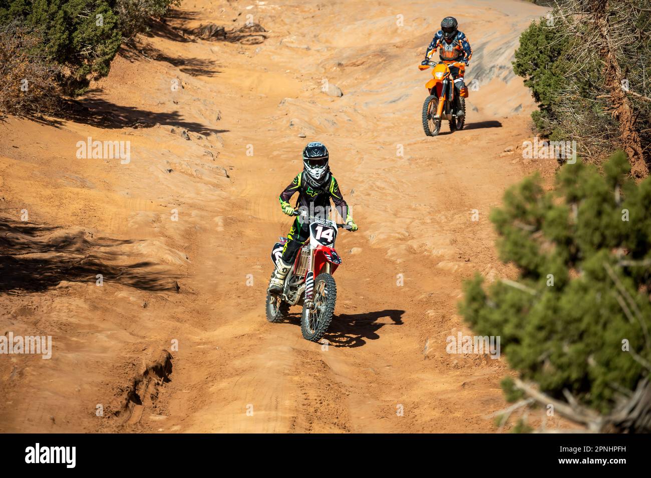 Motocross riders, Hell's Revenge Trail, Sand Flats Recreation Area, Moab, Utah USA Stock Photo