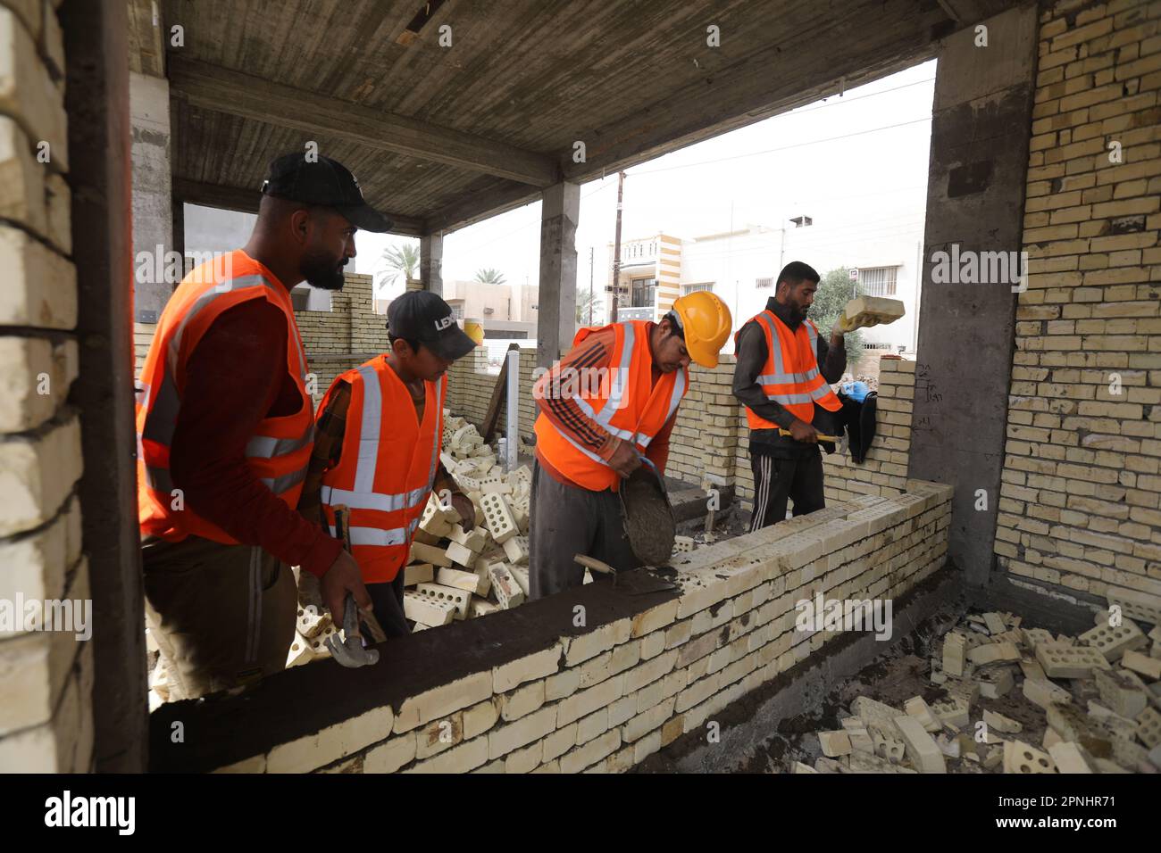 Baghdad, Iraq. 9th Apr, 2023. Iraqi workers work at a school being