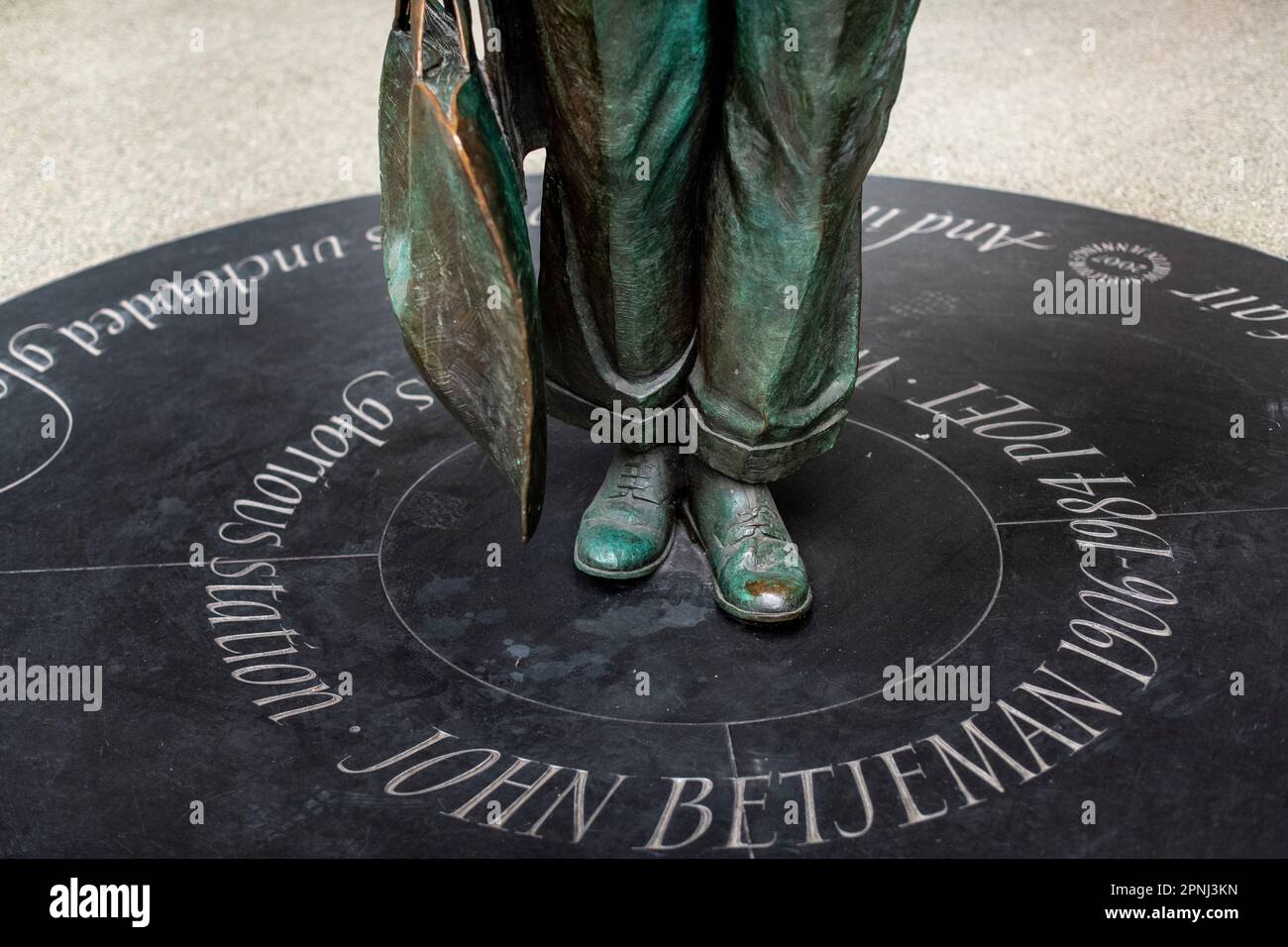 Statue of John Betjeman at St Pancras International train station London UK on upper floor Press your door to pick up your words Stock Photo