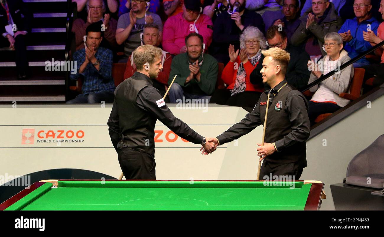 19th April 2023; The Crucible, Sheffield, England 2023 Cazoo World Snooker Championship, Day 5; Jack Lisowski shakes Nippon Saengkhams hand after beating him in there match today Stock Photo