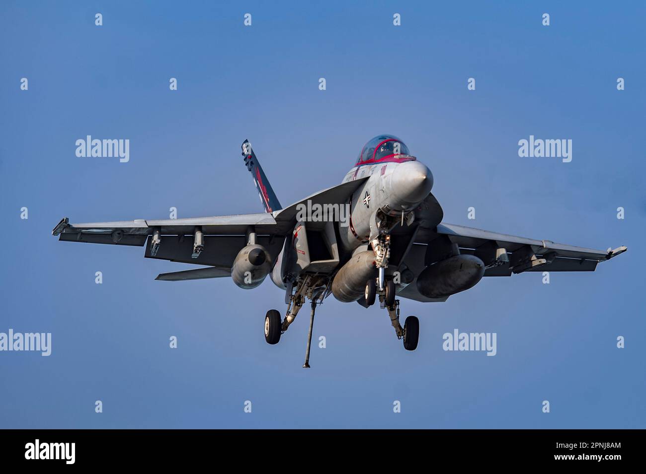 San Diego, United States. 17 April, 2023. A U.S Navy F/A-18F Super Hornet fighter aircraft, with the Fighting Redcocks of Strike Fighter Squadron 22 comes in for an arrested landing on the flight deck of the Nimitz-class aircraft carrier USS Nimitz, April 17, 2023 in the South China Sea.  Credit: MC2 Justin McTaggart/U.S. Navy/Alamy Live News Stock Photo