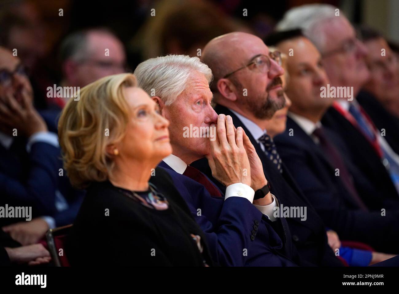 Former US president Bill Clinton listening to speakers during the international conference to