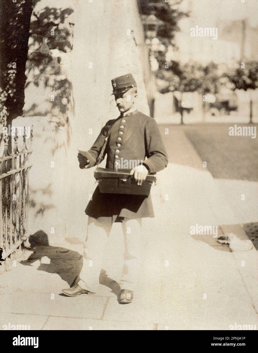 Photograph of a postman in Paris in 1899 by Atget Eugene, Carnavalet Museum in Paris Stock Photo