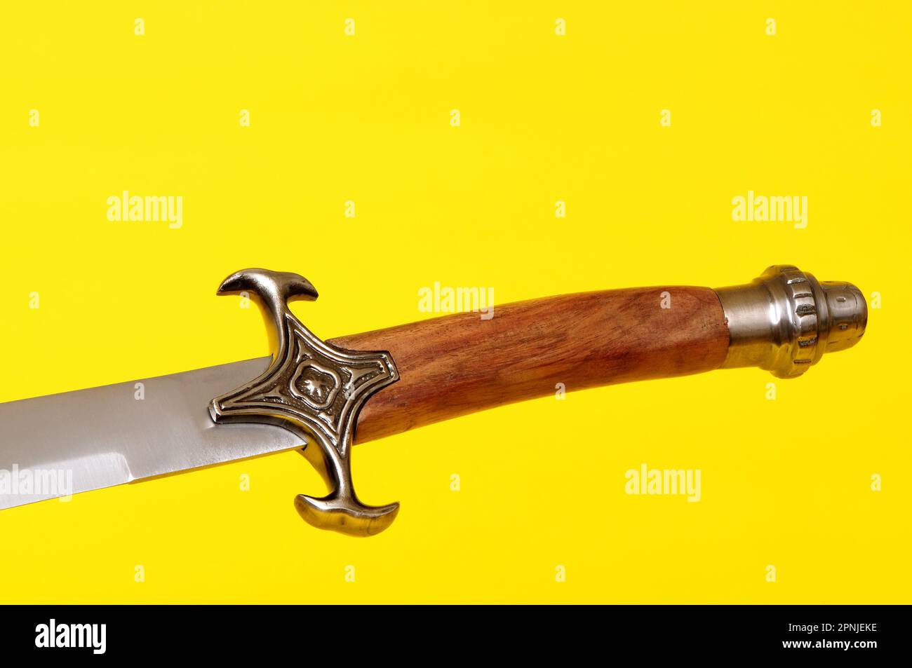 Scimitar blade, guard, and hilt isolated over yellow Stock Photo Alamy