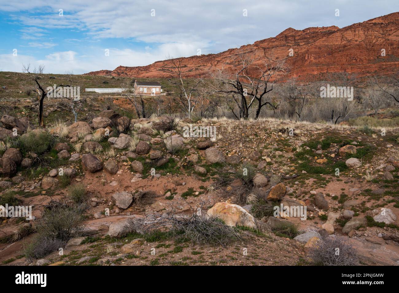 Ruins of old Harrisburg Ghost town in Southern Utah, USA.  Snow covered Pine Valley Mtns in the background. Stock Photo