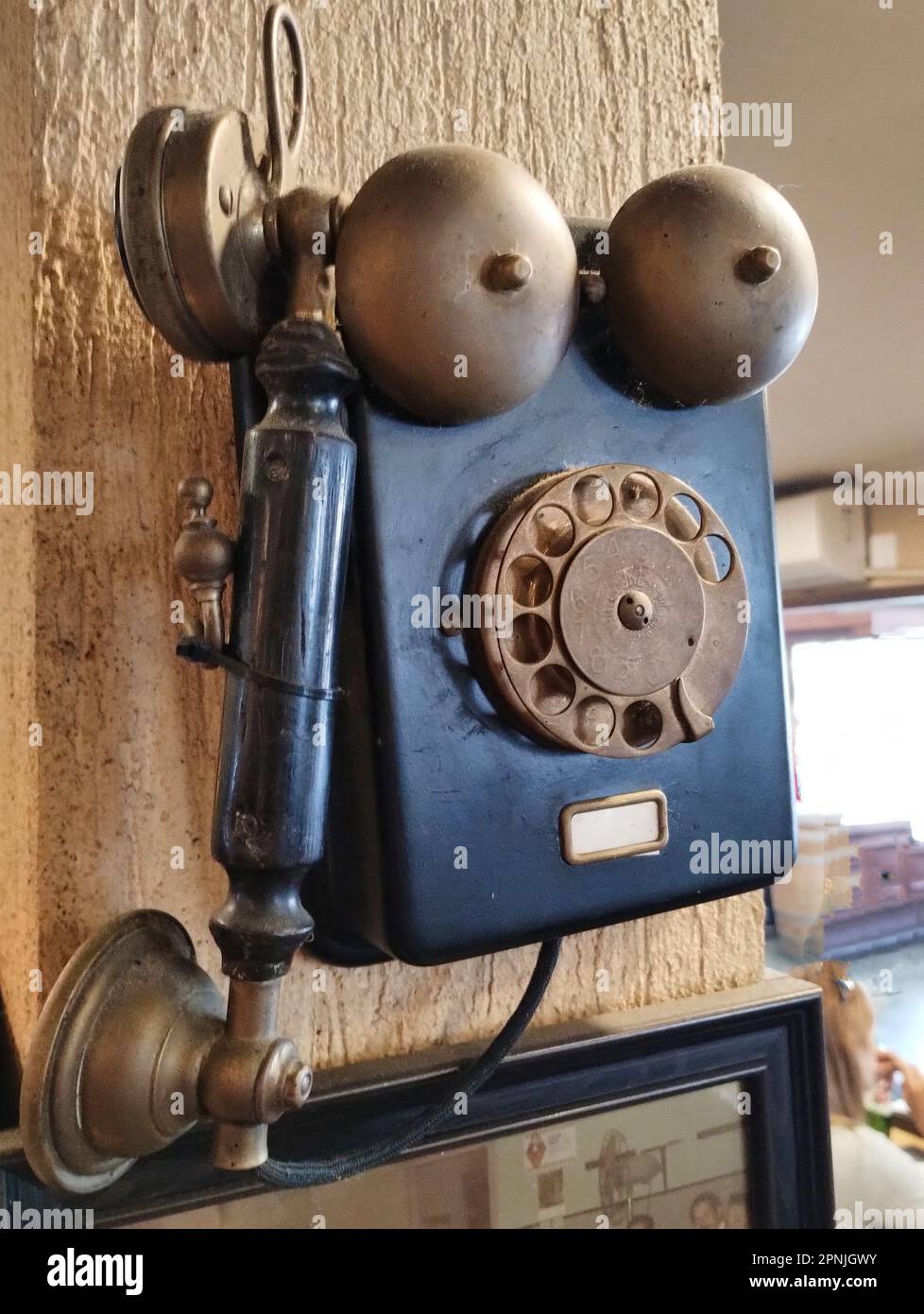 old black wall phone used as decoration Stock Photo