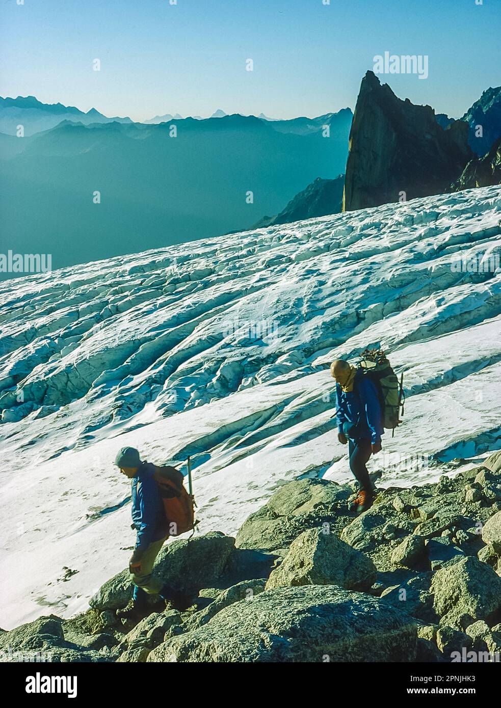 Climbers skirt above the Trient glacier at Cochers Du'Portalet near the Cabane D'Orny on the Chamonix to Zermatt Haute Route Stock Photo