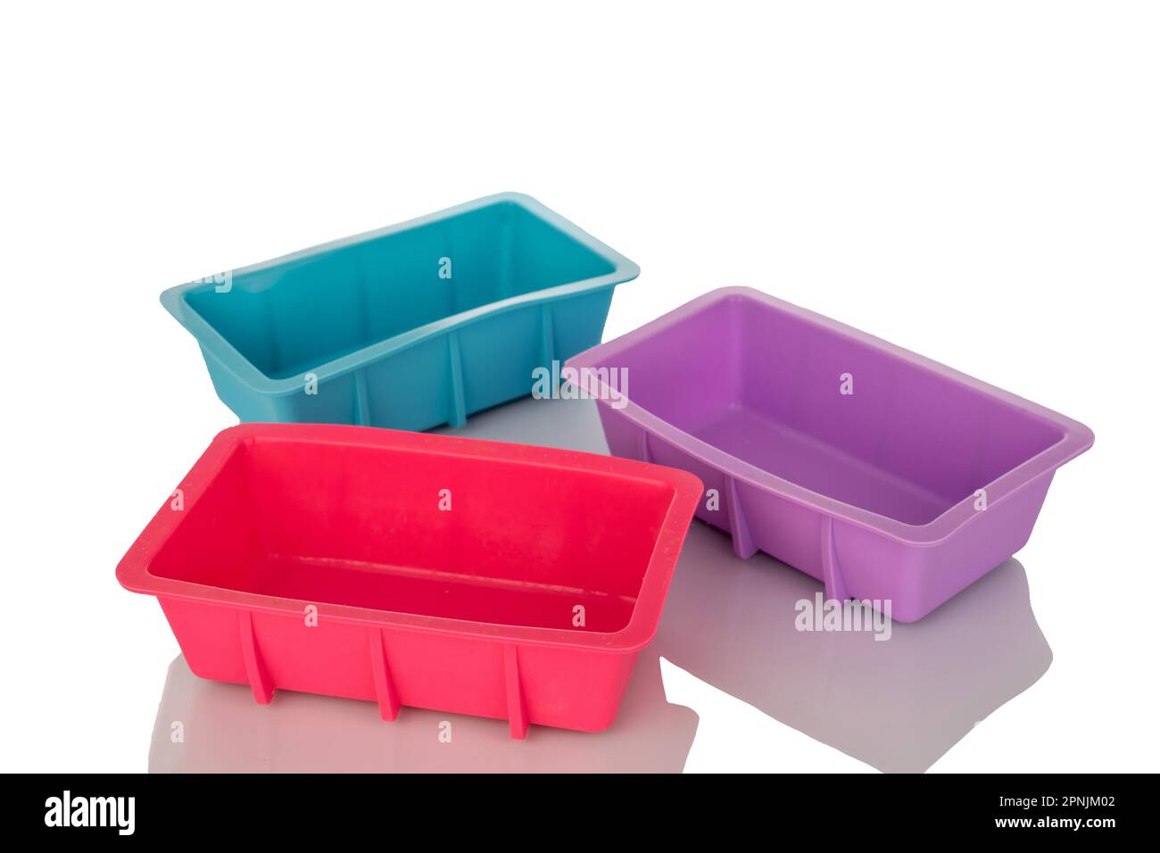 Three silicone molds for baking, macro, isolated on white background. Stock Photo