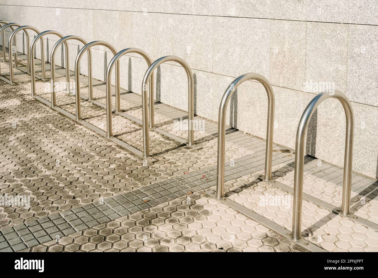 Bars to park bicycles, empty, installed at the entrance of a building ...