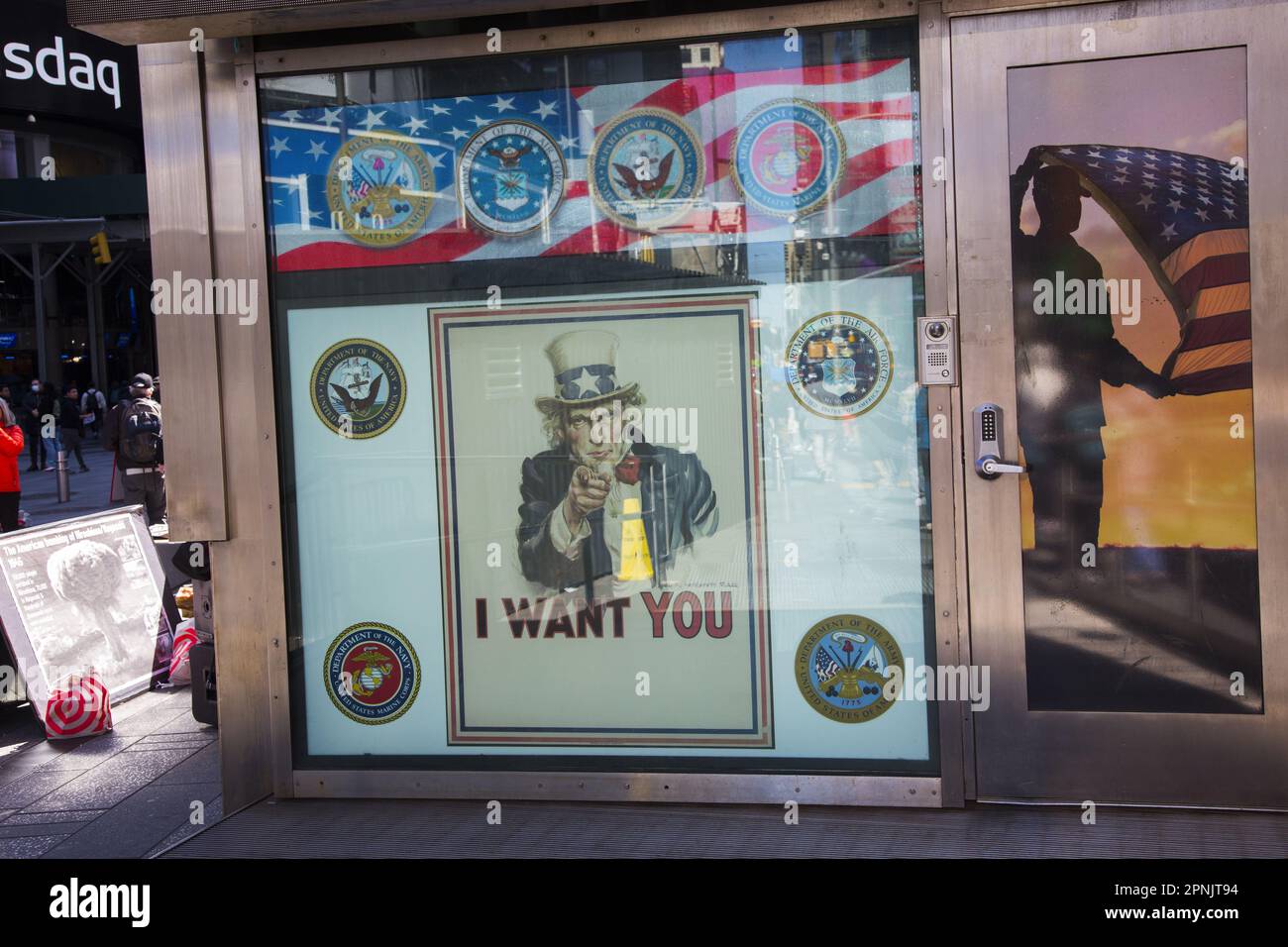 Entrance to the U.S. Armed Forces Recruiting Station in Times Square, NYC,  at 43rd Street and Broadway. The 'Uncle Sam Wants You' poster adorns the front window. Stock Photo