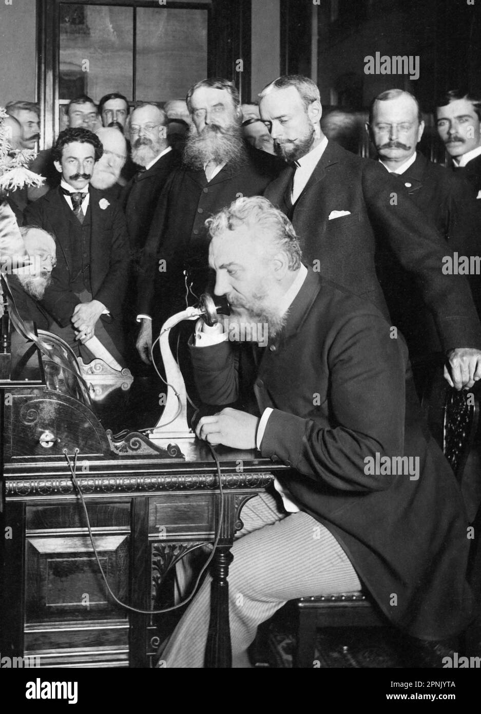 Alexander Graham Bell telephone. Photograph of the Scottish born inventor of the first practical telephone, Alexander Graham Bell (1847-1922), at the opening of the New York and Chicago telephone line in October 1892. Photograph by E J Holmes. Stock Photo