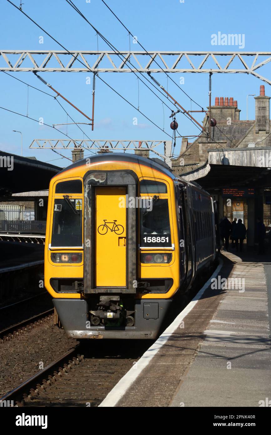 Northern trains express sprinter dmu 158851 in Carnforth railway station with ordinary passenger service 19th April 2023. Stock Photo