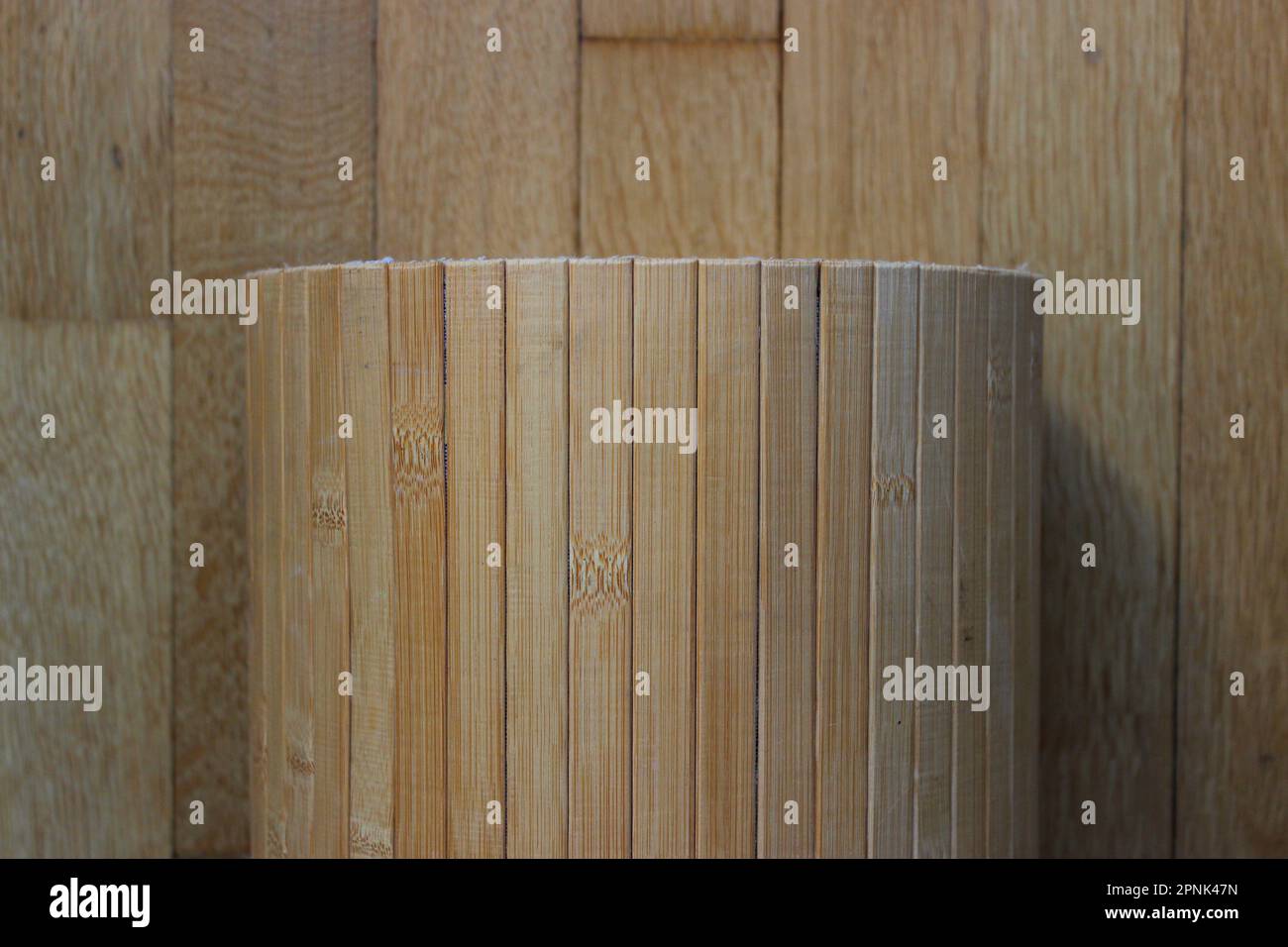 Bamboo Planks Roll On A Wooden Parquet Stock Photo For Backgrounds Stock Photo