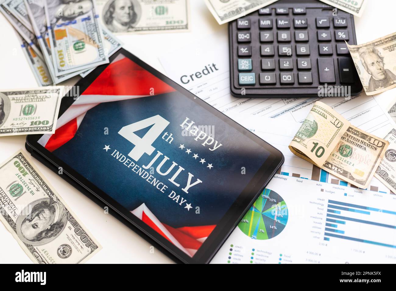 business, office, school and money concept - chart paper, tablet pc 