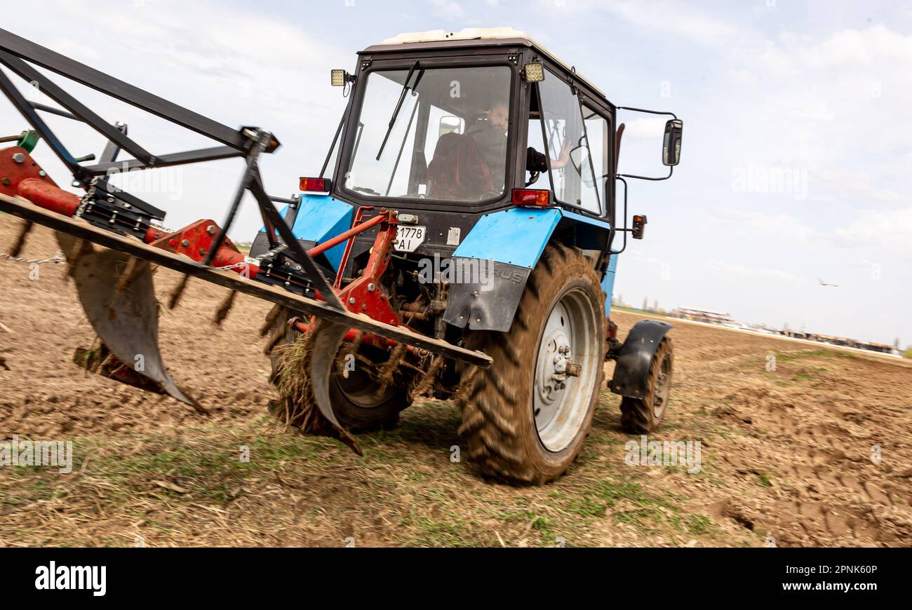 Artem, a farmer from Skybyn, near Kyiv, the capital of Ukraine, drives ...
