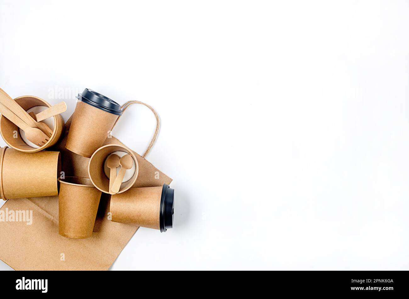 Top view on disposable paper cups, launch box, wooden cutlery. Kraft ...