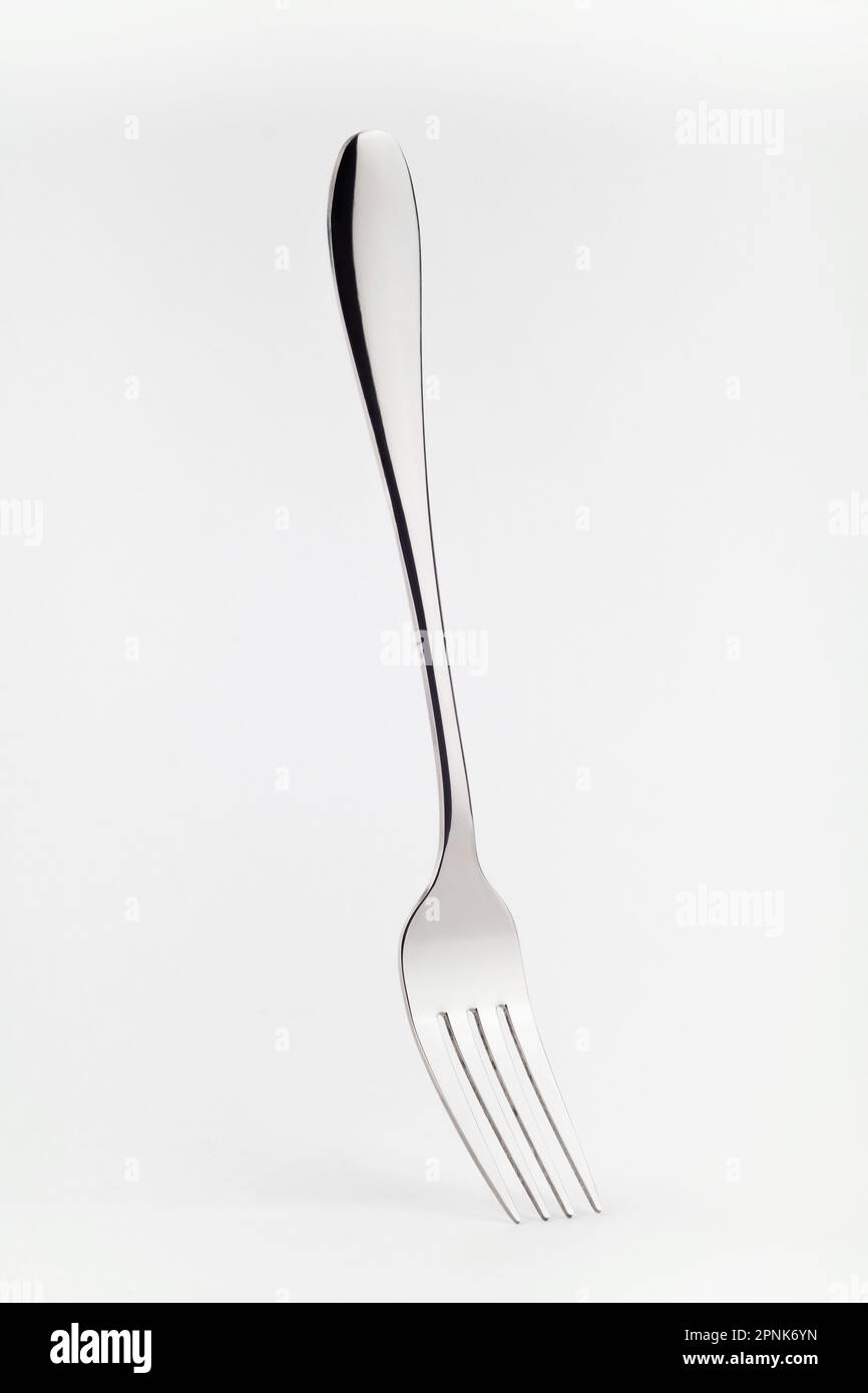 Levitating fork on a white background. Front view. Stock Photo
