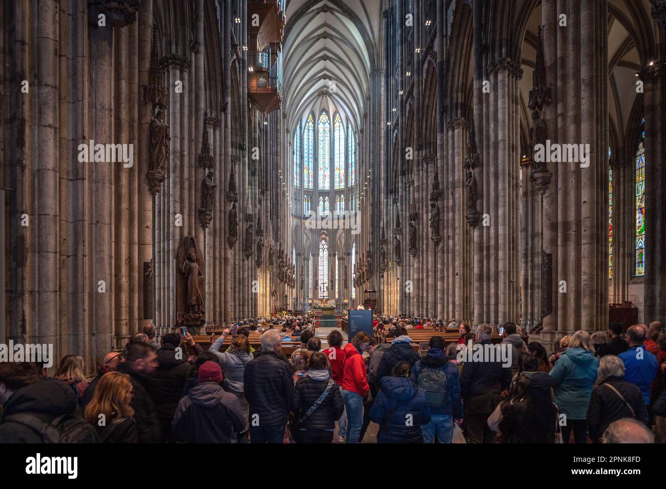 Tourists visiting the Cologne cathedral, Germany Stock Photo