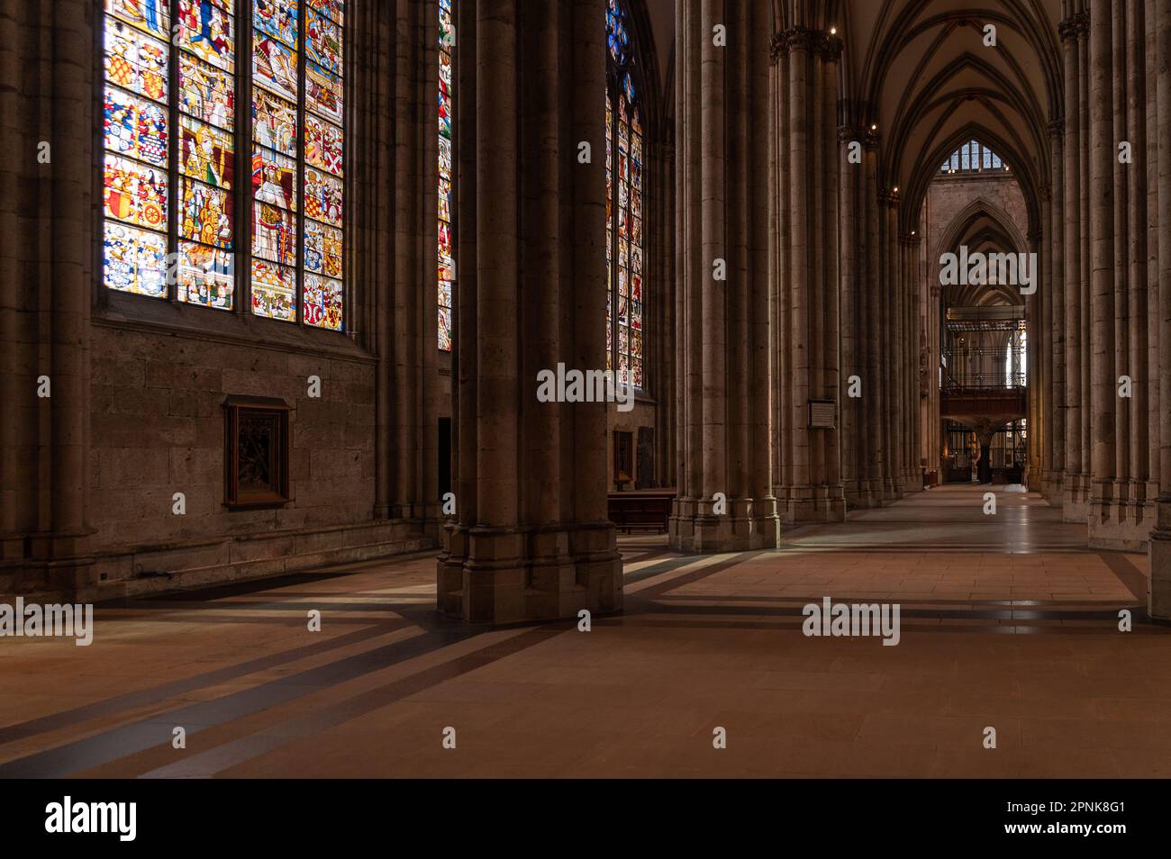 Colonnade and stained glass of the Cologne cathedral, Germany Stock Photo